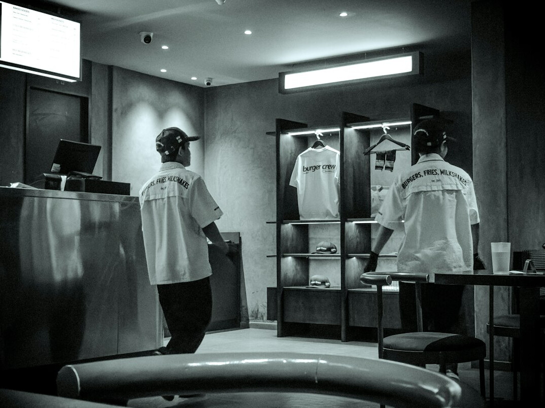 store security guard watching customers