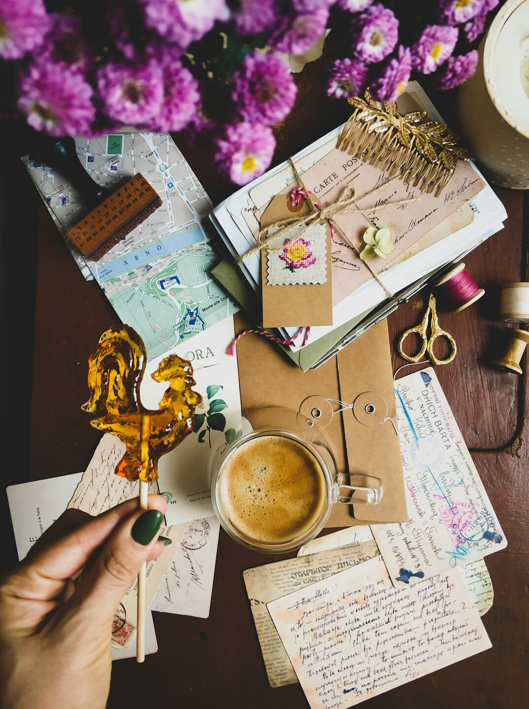 Hand writing in a journal next to an envelope