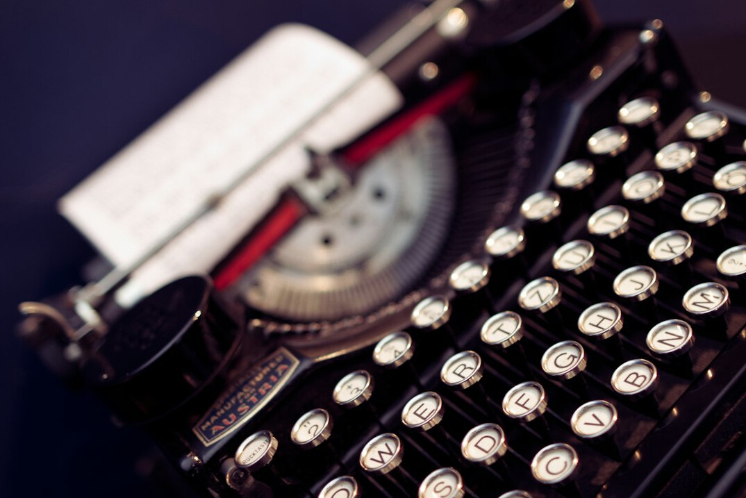 Close-up of an old typewriter with paper