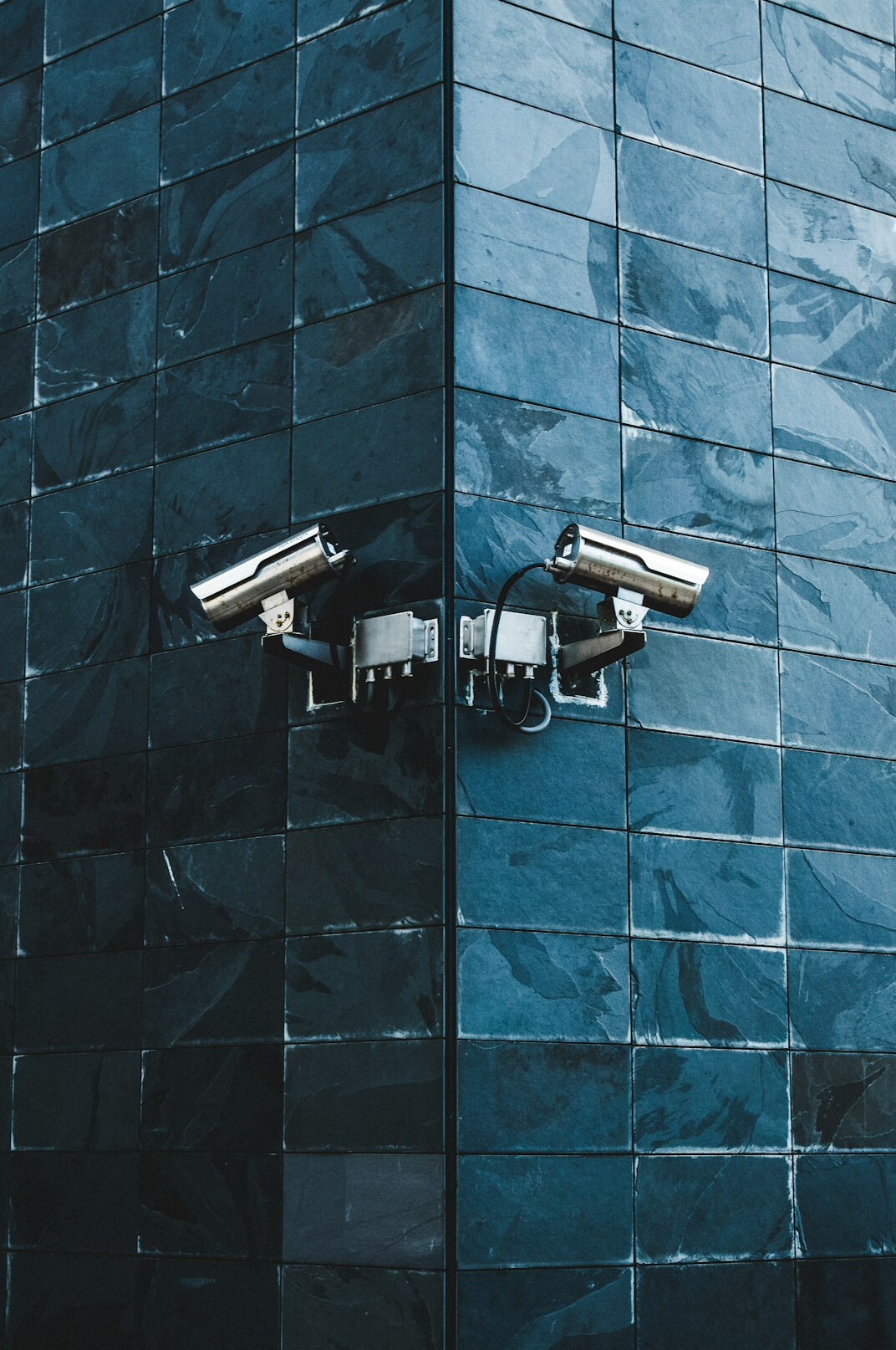 store security guard monitoring cameras