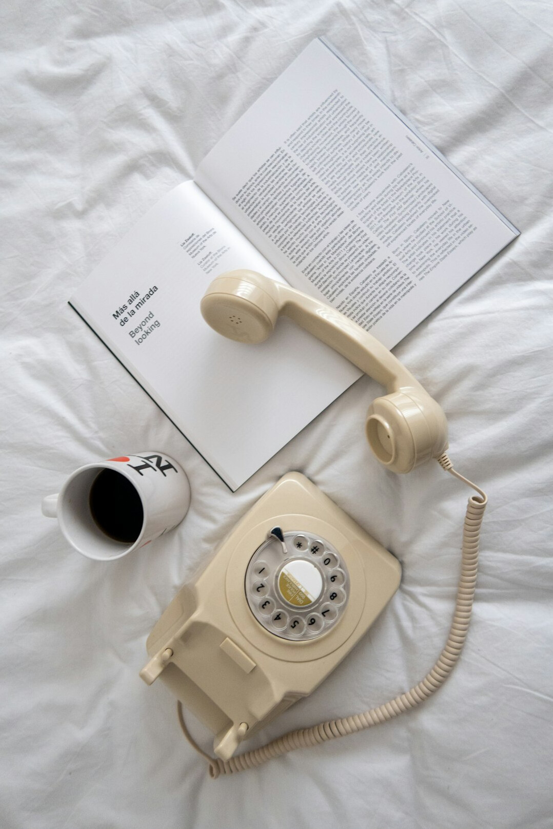 Vintage telephone and letters on a wooden desk