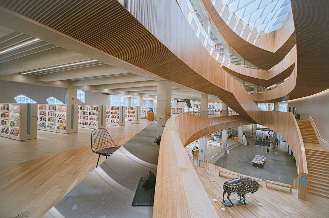 Interior of a library with tall wooden bookshelves